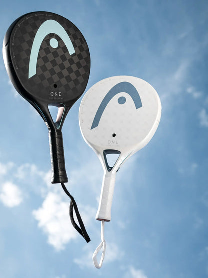 HEAD One Ultralight Padel Racquet in black and white against a blue sky, showcasing lightweight design.