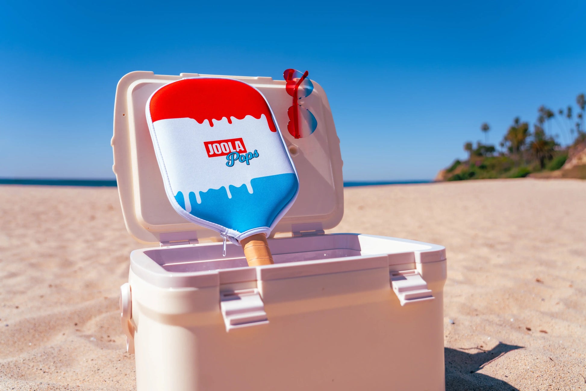 Joola Perseus Pro V Rally Rocket (Limited Edition) resting on a beach cooler on a sunny day.