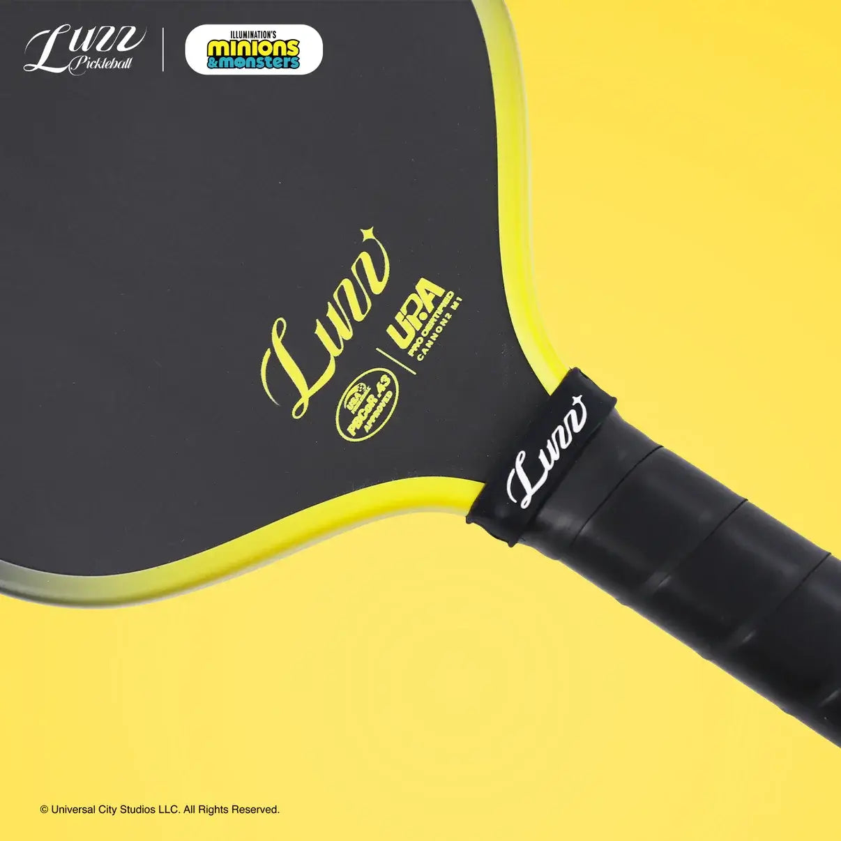 Luzz Minions Cannon2 M1 Paddle with black surface and yellow accents, designed for power and durability.
