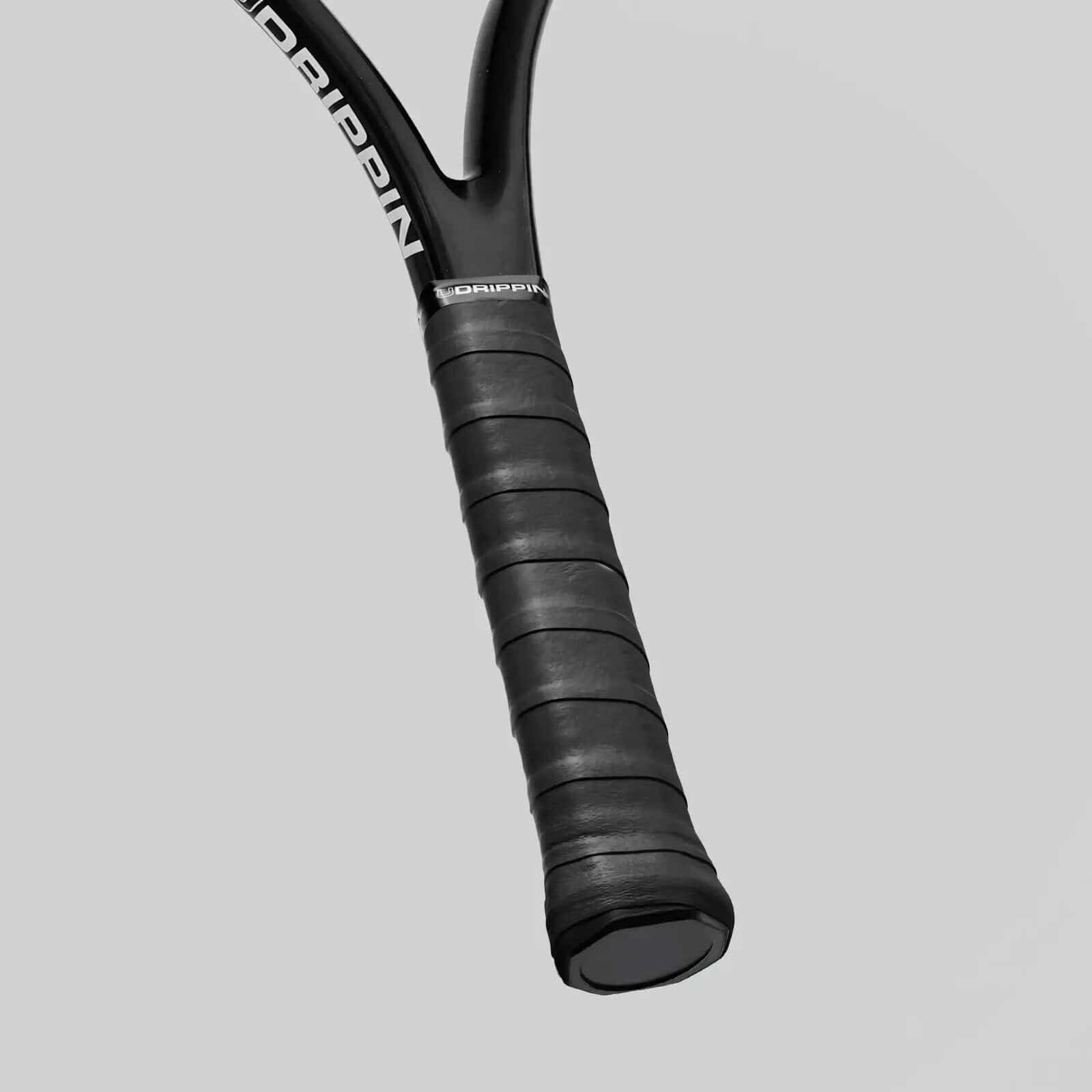 Udrippin Pitch Black - Pro Tour racquet grip showcasing superior tackiness and sweat absorbent features.