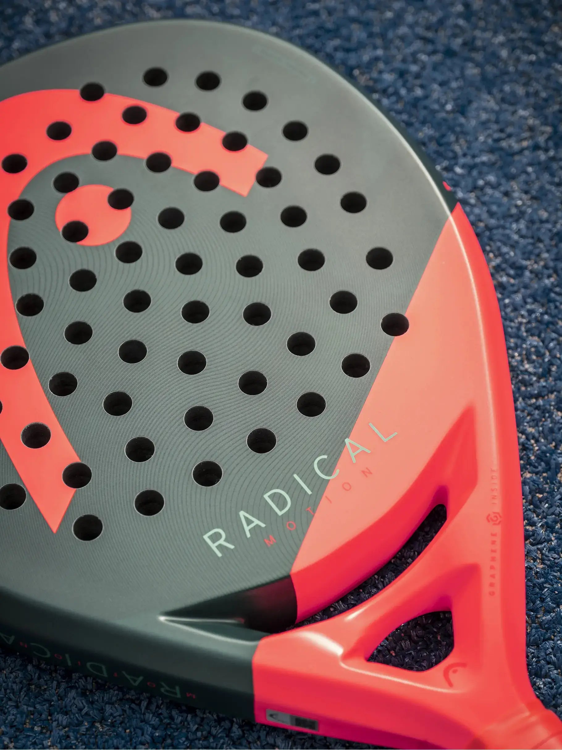HEAD Radical Motion Padel Racquet featuring a unique design and perforated surface for enhanced playability.