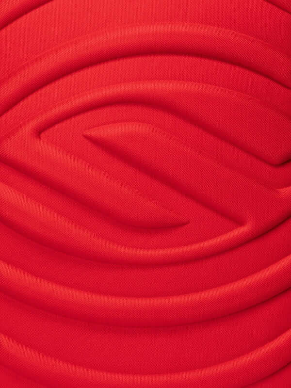 Close-up of the textured red fabric on the Selkirk LABS Prestige Pickleball Backpack.