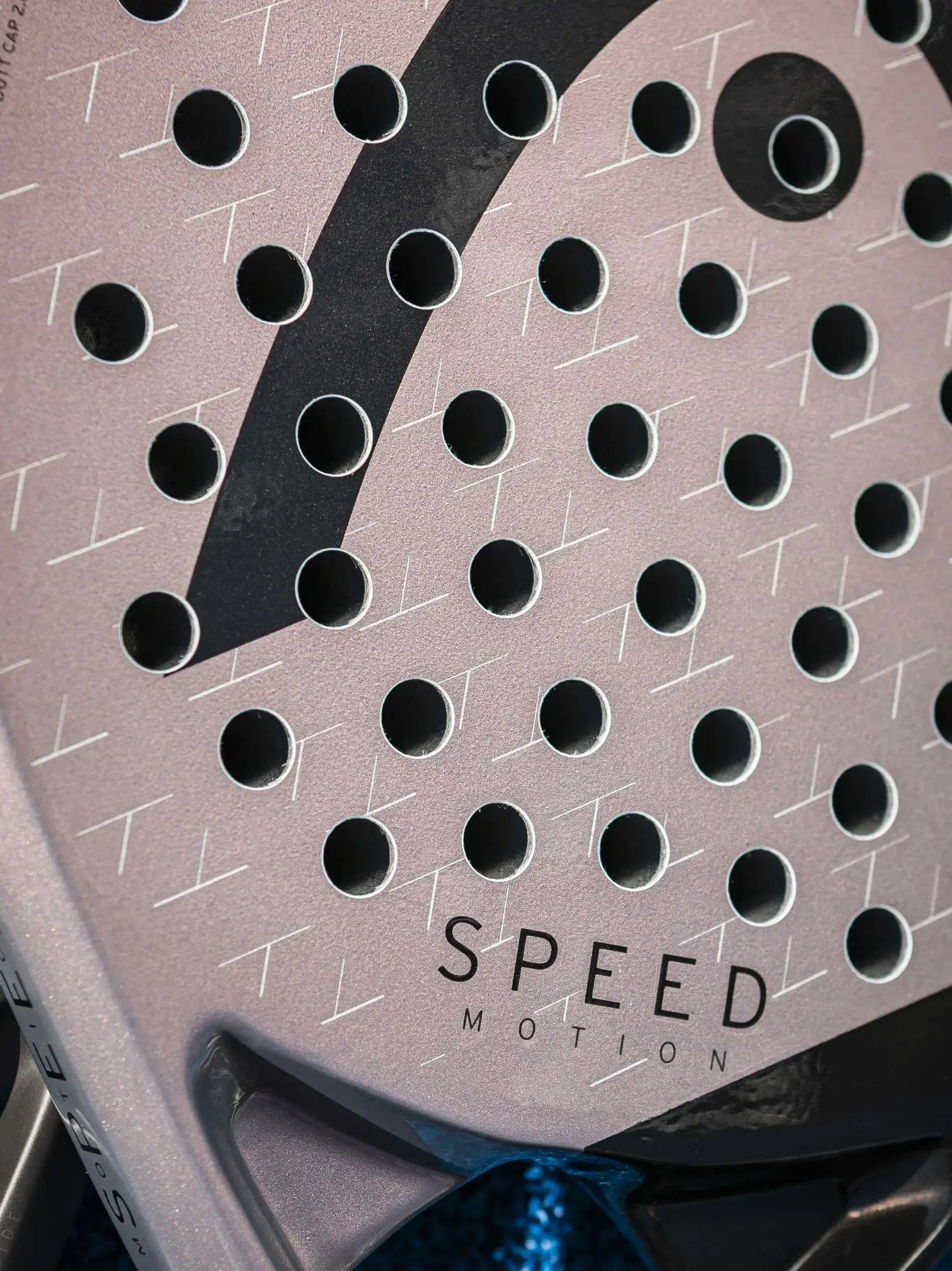 Close-up of HEAD Speed Motion Padel Racquet showcasing innovative design and perforated surface.