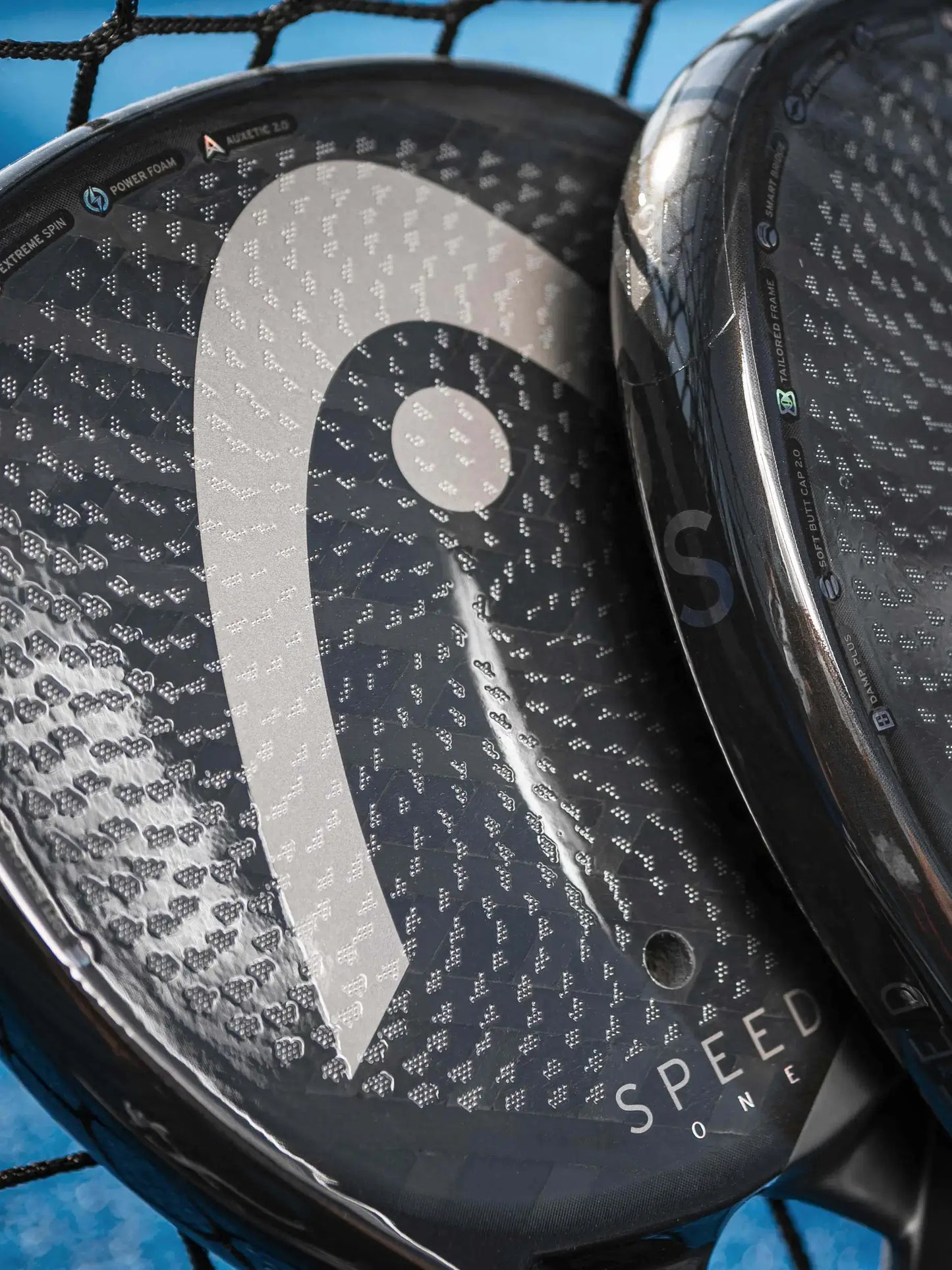 HEAD Speed One Padel Racquet close-up showing the unique design and texture of the hitting surface.