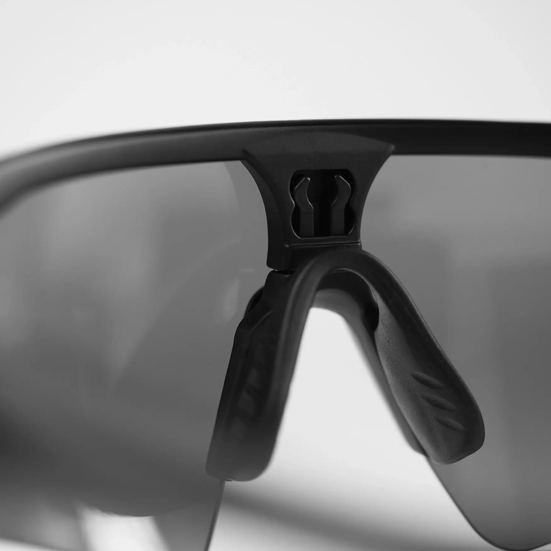 Close-up view of UDRIPPIN "NIZO" sunglasses with Mirror Grey Contrast Lens.