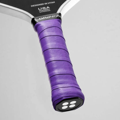 Udrippin Purple Magic - Pro Tour purple grip on a pickleball paddle, showcasing high quality tack and sweat absorbent features.