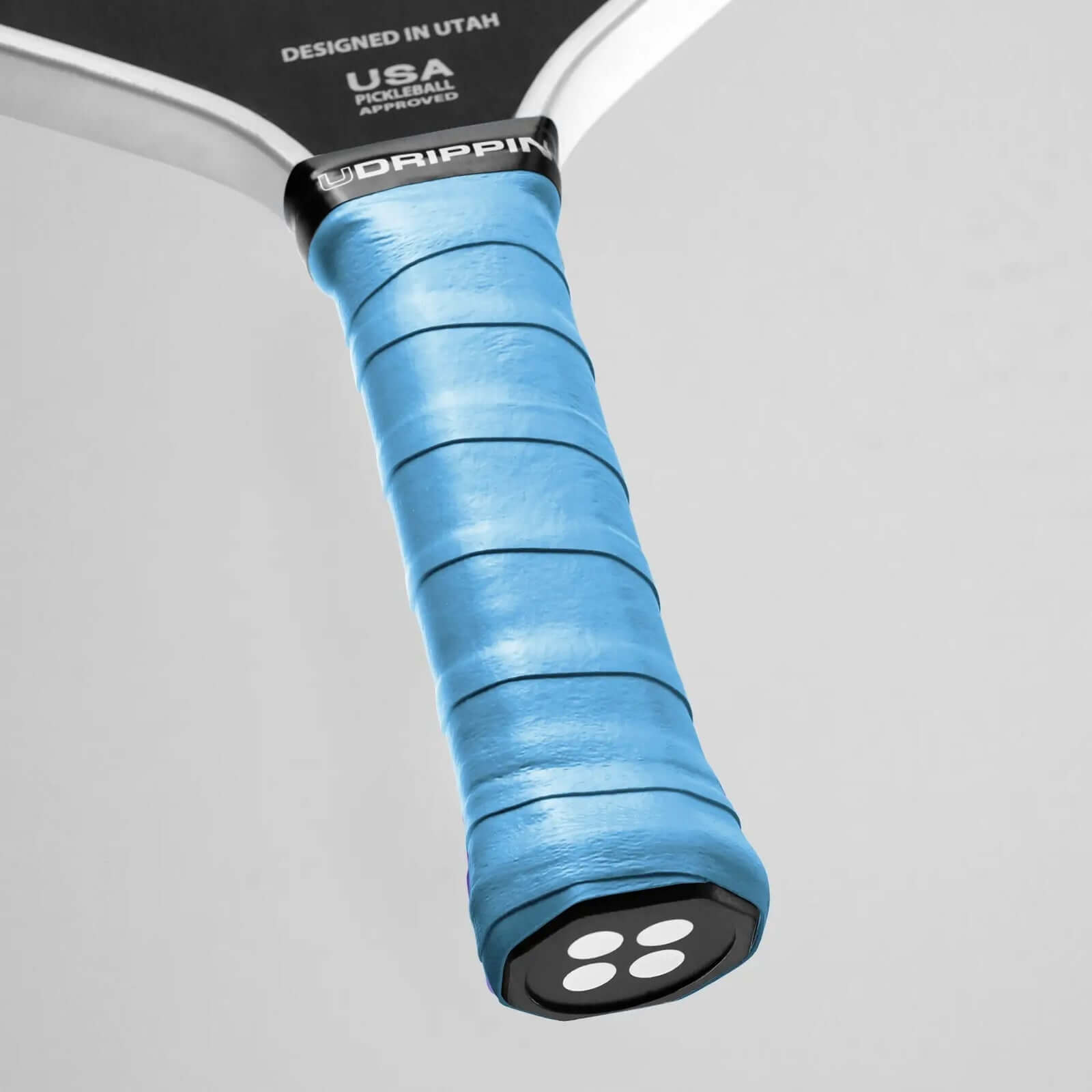 Udrippin Sky Blue - Comfort Tour grip on a pickleball paddle, showcasing its comfort and high-quality material.