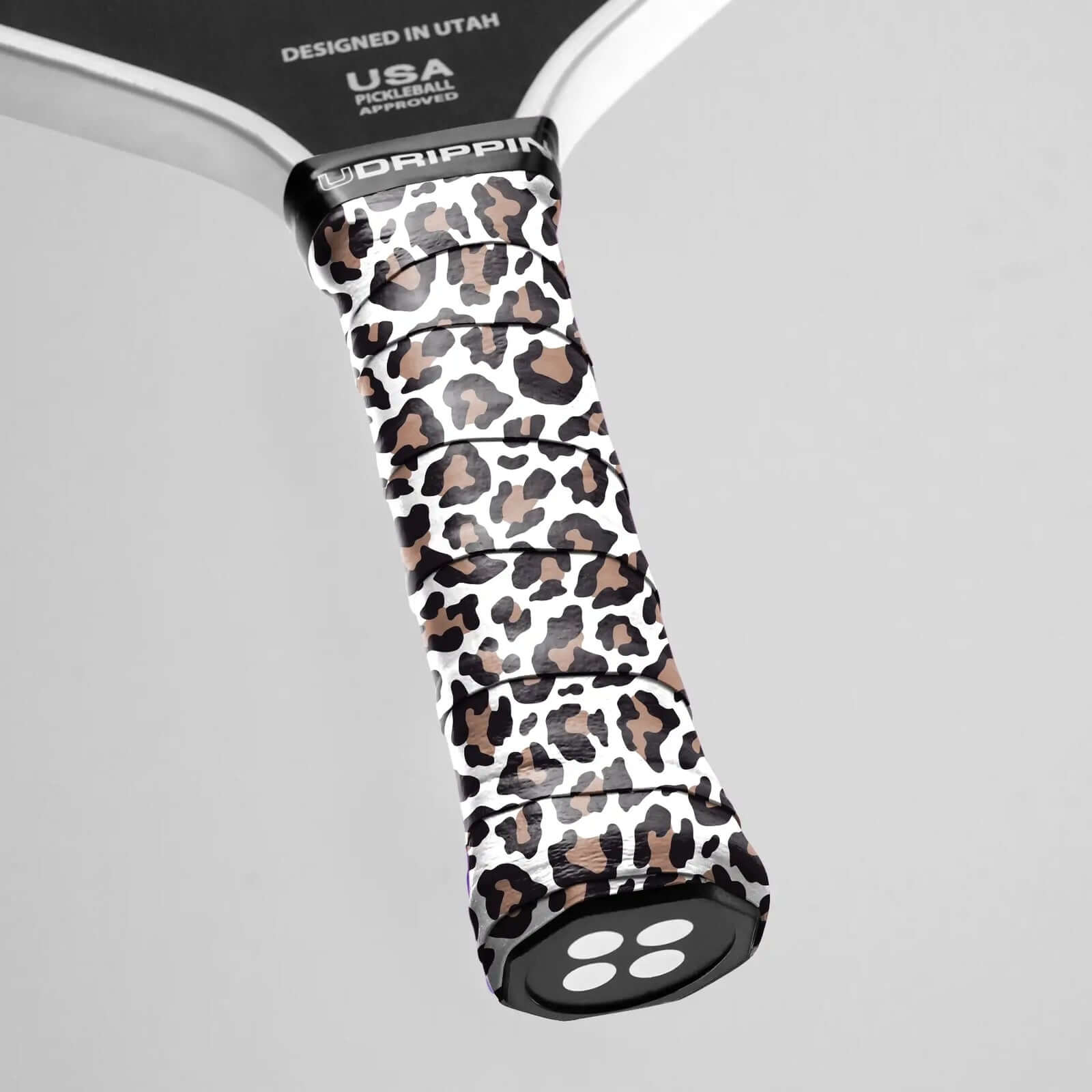 Udrippin White Leopard Print - Custom Grips on a pickleball racket for style and secure grip.